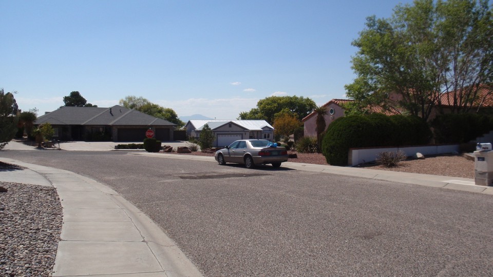 golf course is behind these two houses