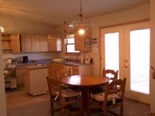 kitchen eating area eating area between the kitchen and the den.  french doors open to the back yard.