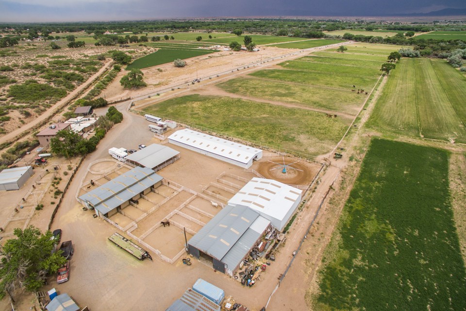 overview of barns and pastures looking east.